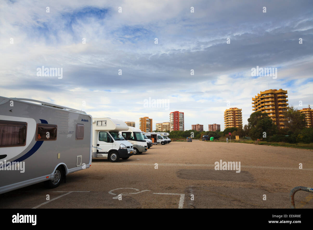 Motor homes parked up by high rise flats at Playa de La Garrofera Spain Stock Photo
