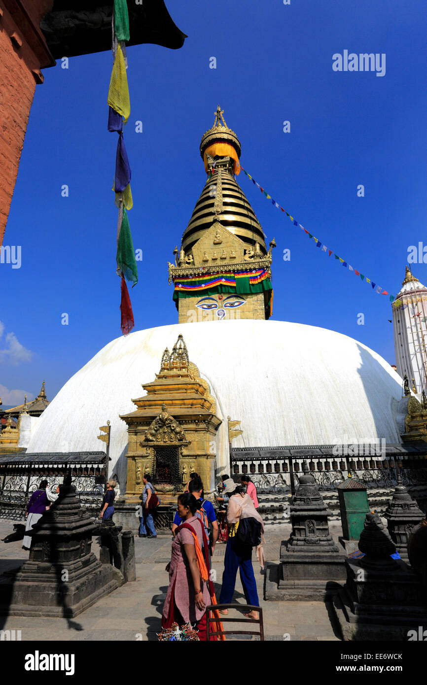 People spinning the Religious Prayer Wheels at the Buddhist Stupa ...