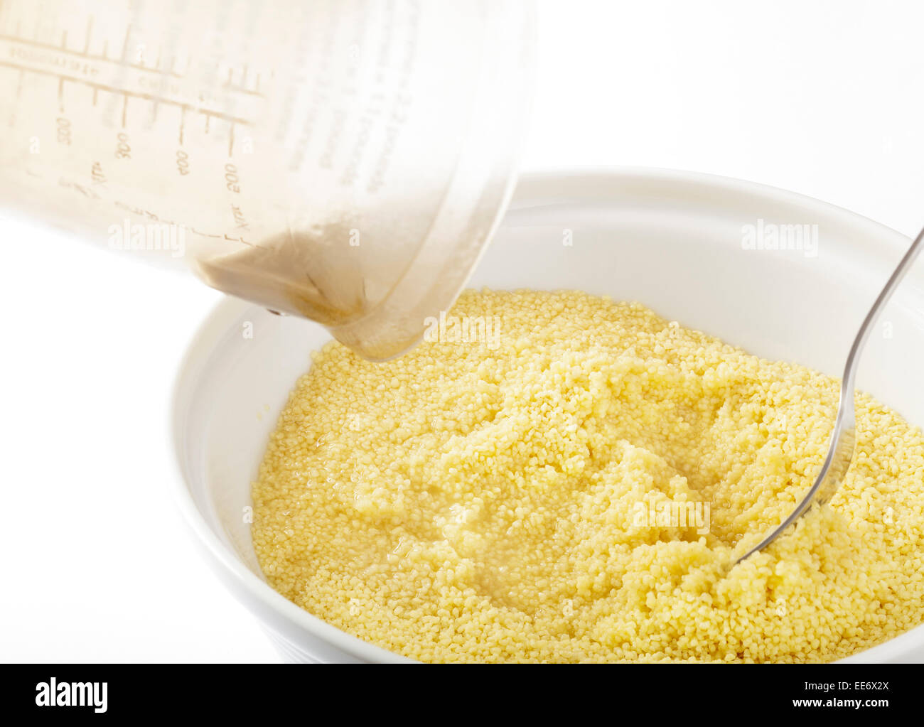 pouring boiling water onto couscous Stock Photo Alamy