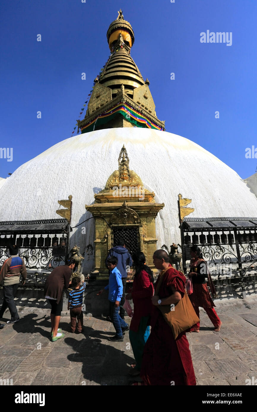 People spinning the Religious Prayer Wheels at the Buddhist Stupa ...