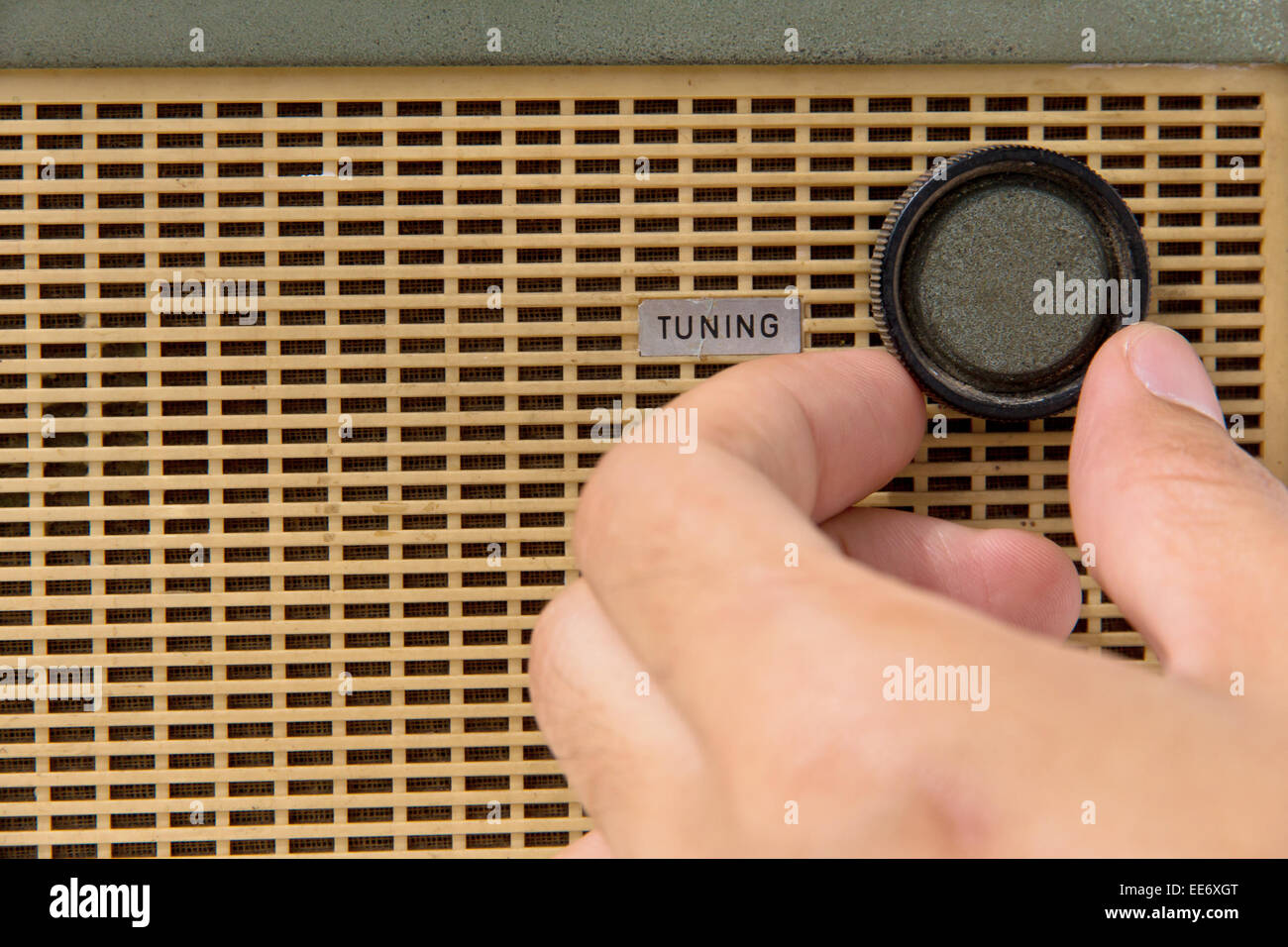 hand with tuner radio knob Stock Photo