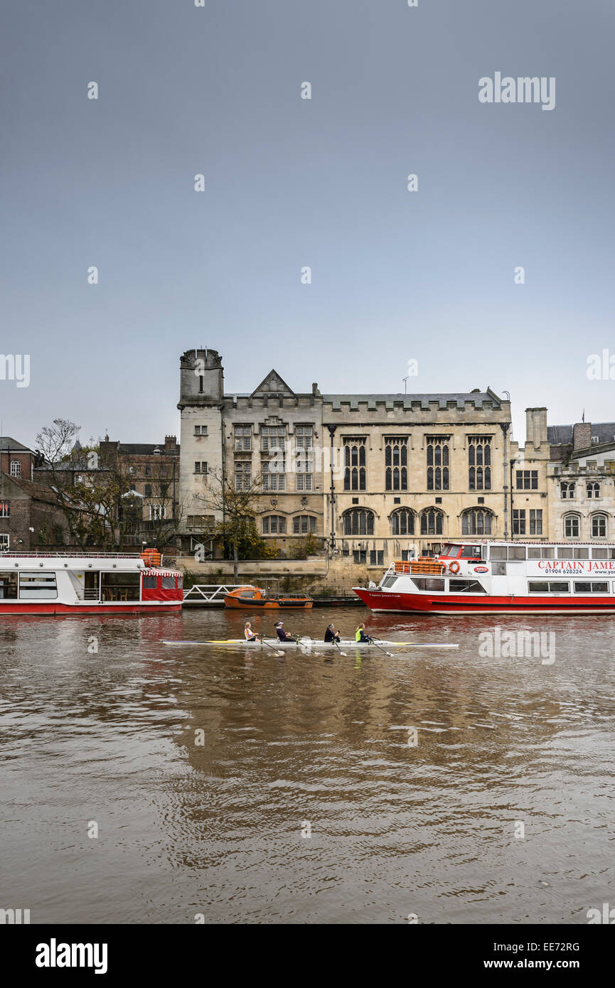A female rowing crew practices practises trains training on the River Ouse in York, UK. Stock Photo