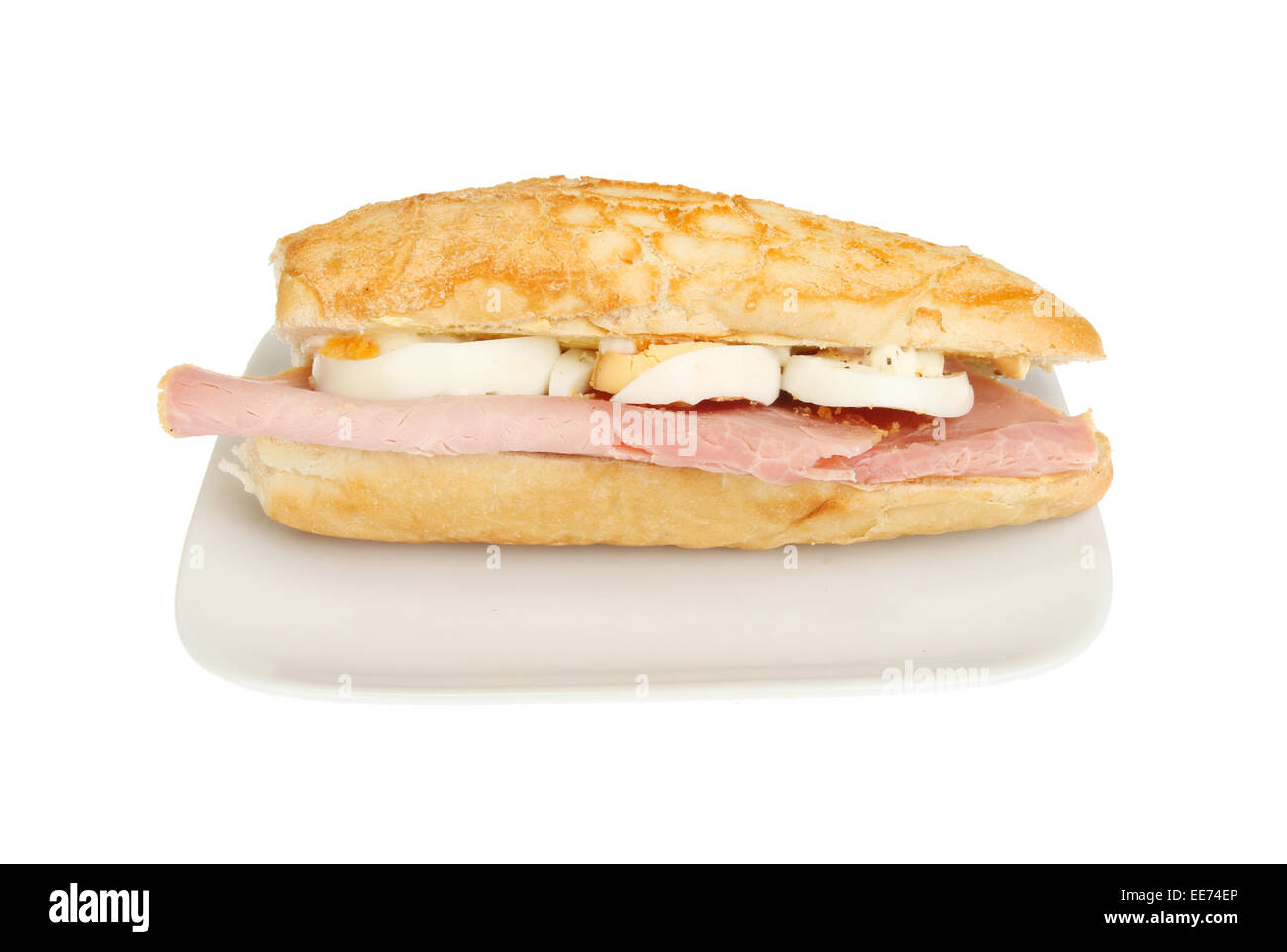 Ham and egg giraffe roll on a plate isolated against white Stock Photo