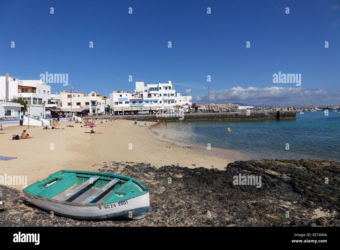 Old town beach and quay with blue sky and bout in the foreground Corralejo  Fuerteventura "Las Palmas" "Canary islands Spain Stock Photo - Alamy