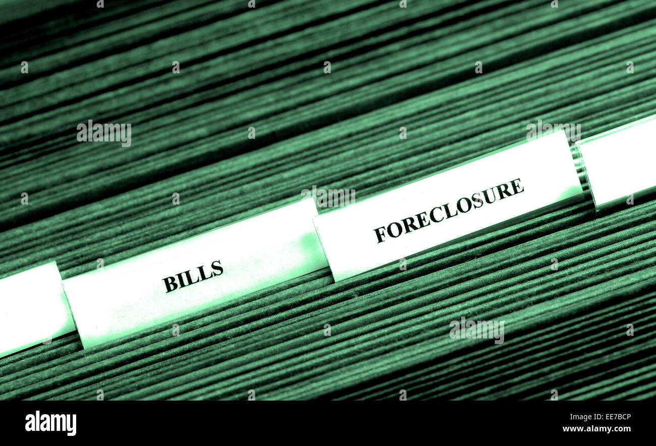 Detail of file folders for bills and foreclosure personal finances Stock Photo