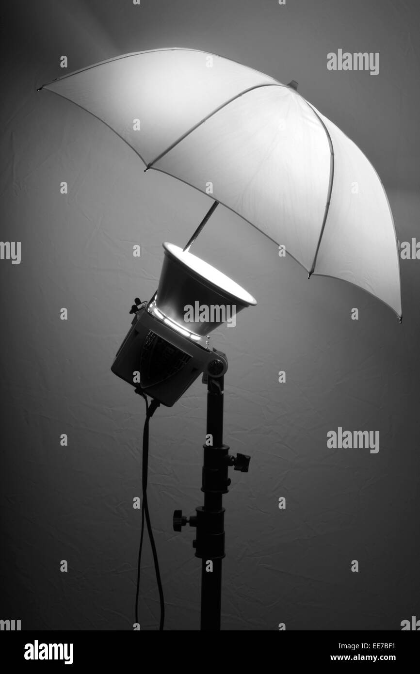 Detail of studio flash strobe light and umbrella on stand strobist professional photographer Stock Photo