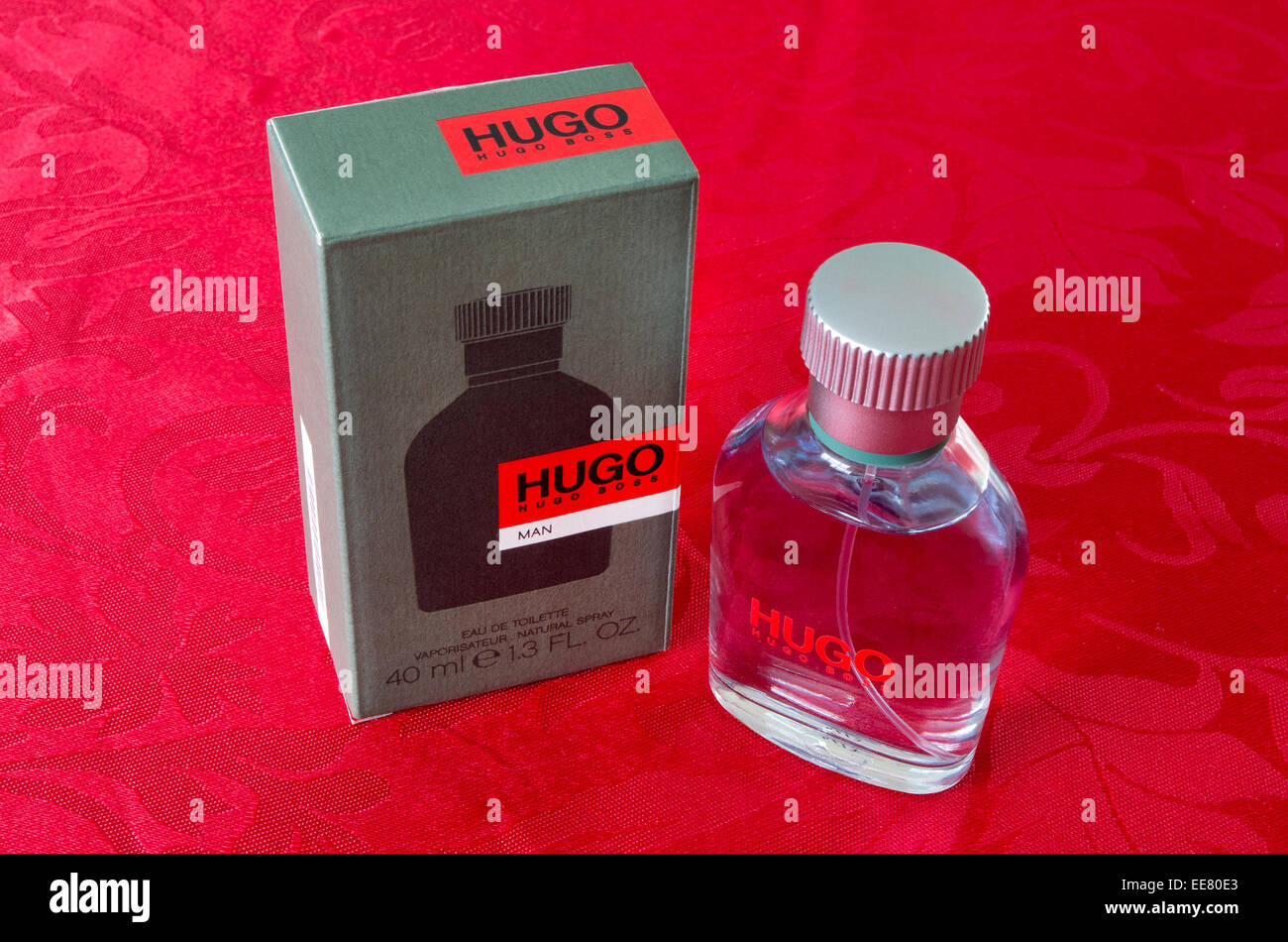 Hugo Boss Man Eau De Toilette red bottle fragrance mens men aftershave logo  product cutout white background copy space isolated Stock Photo - Alamy