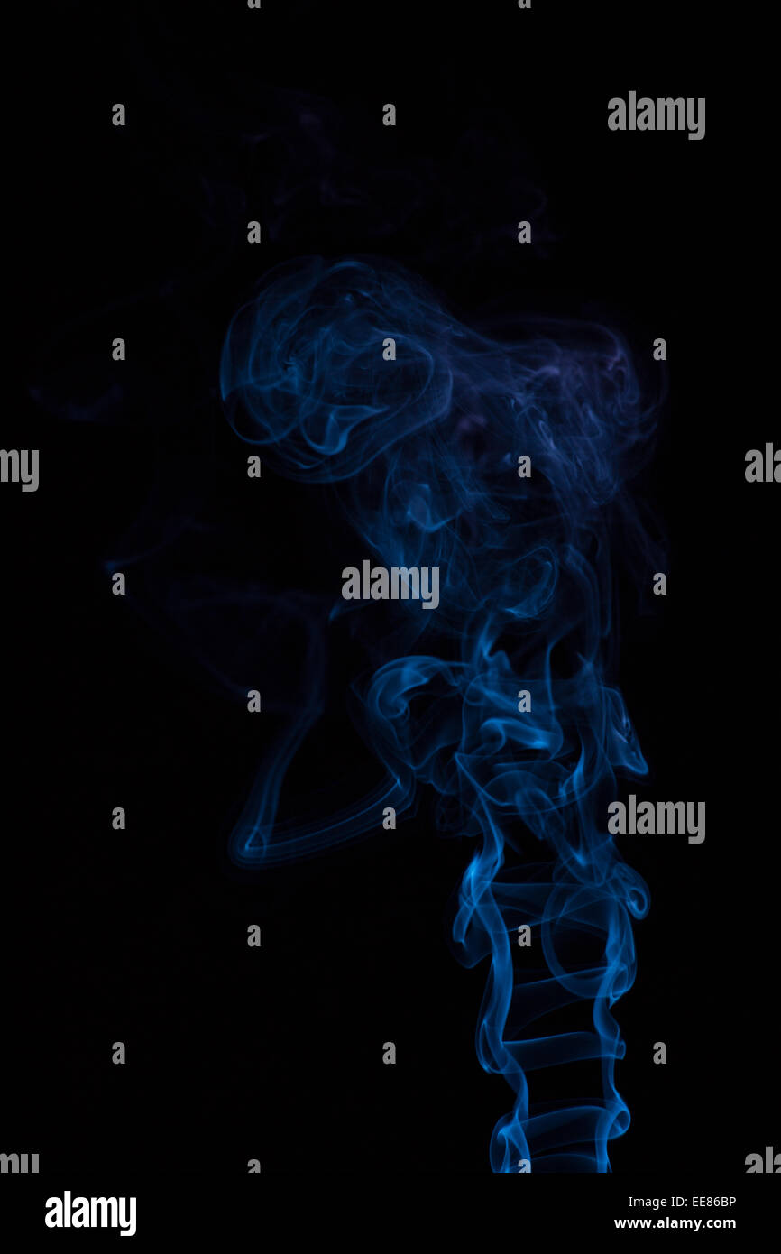 Abstract blue smoke isolated on black Stock Photo - Alamy