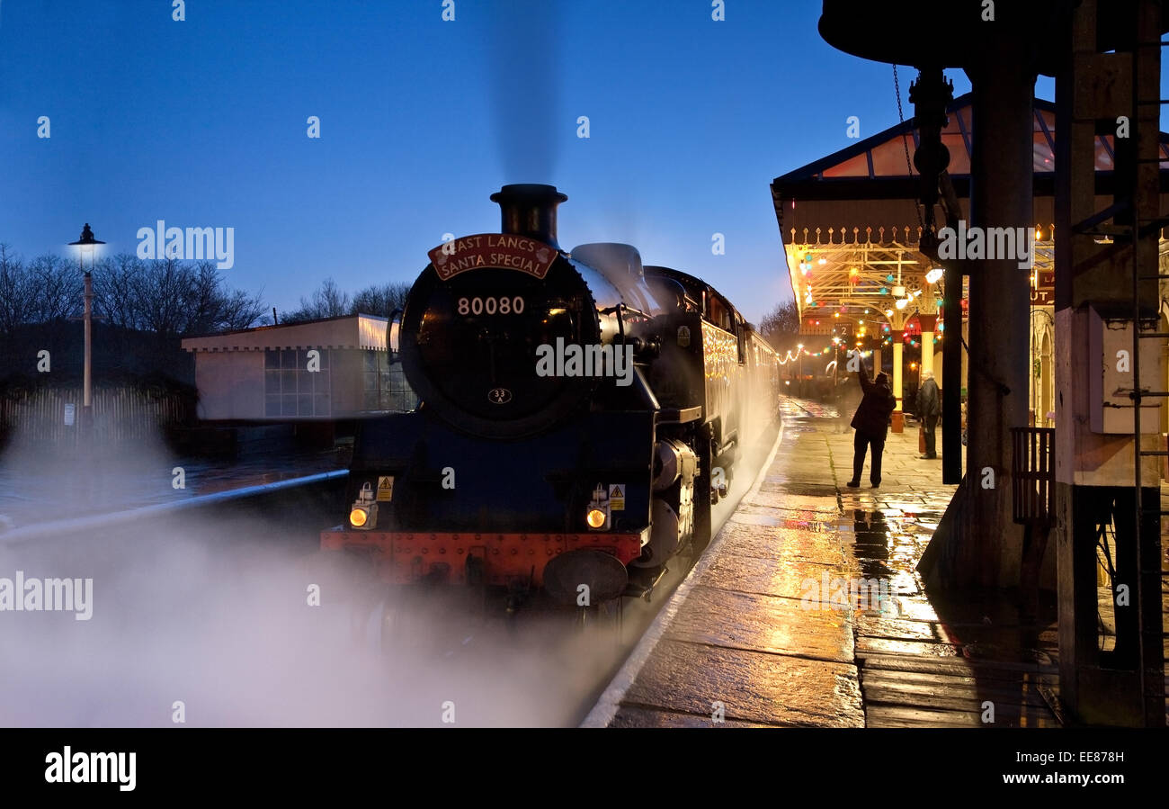 The Santa Express steam train leaves Ramsbottom station on Christmas Eve in Lancashire Stock Photo