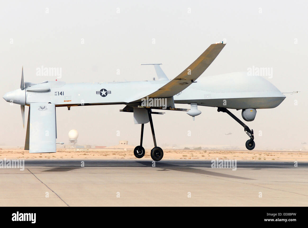 MQ-1 Predator unmanned aerial vehicle (UAV) takes off in Southwest Asia. See description for more information. Stock Photo