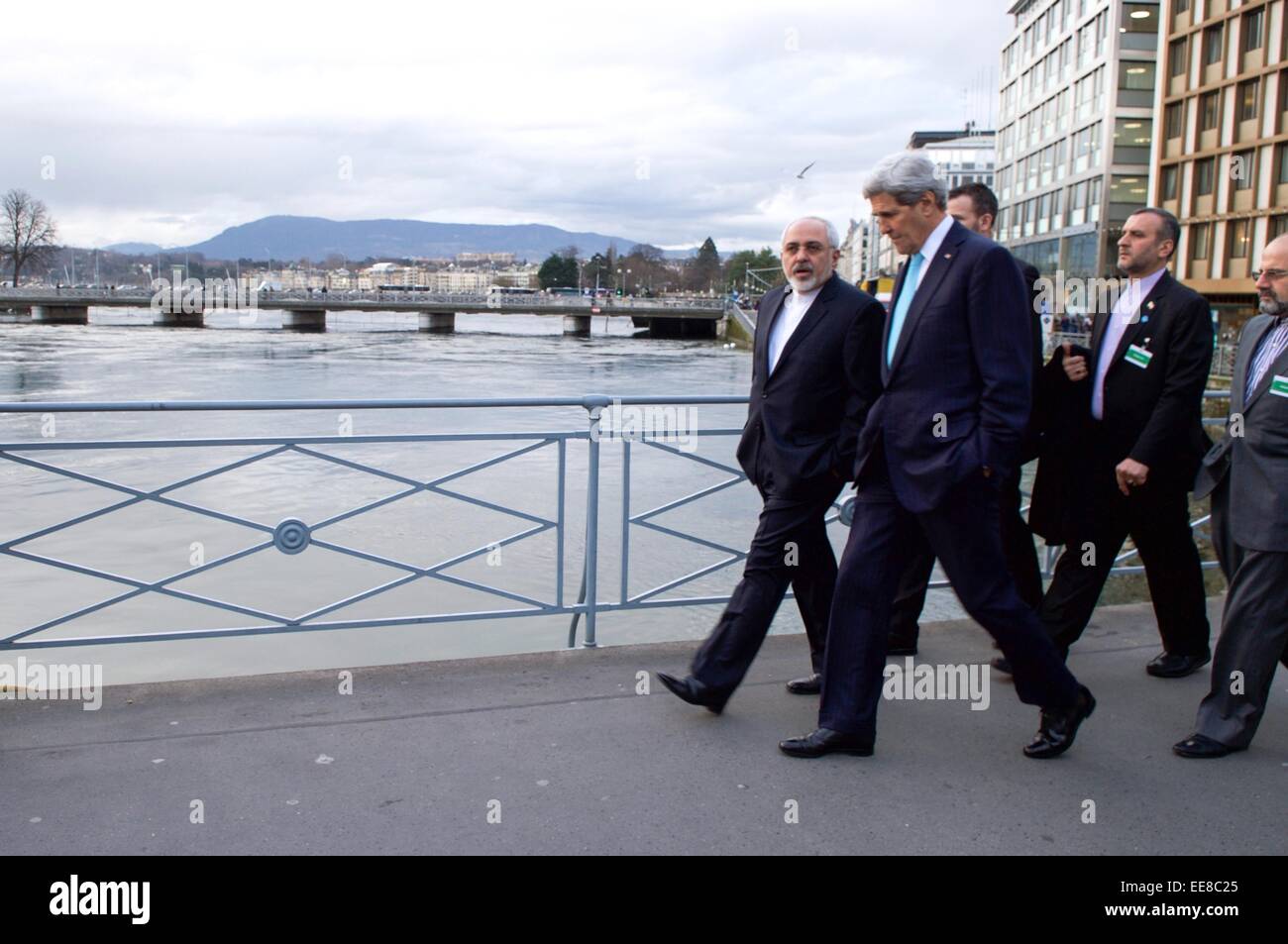 US Secretary of State John Kerry walks with Iranian Foreign Minister Zarif during a break in negotiations about the future of Iran's nuclear program January 14, 2014 in Geneva, Switzerland. Stock Photo