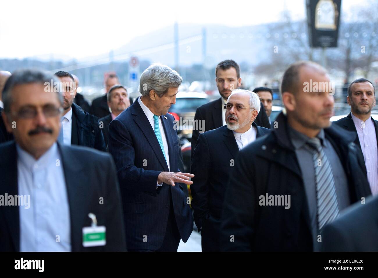 US Secretary of State John Kerry walks with Iranian Foreign Minister Zarif during a break in negotiations about the future of Iran's nuclear program January 14, 2014 in Geneva, Switzerland. Stock Photo