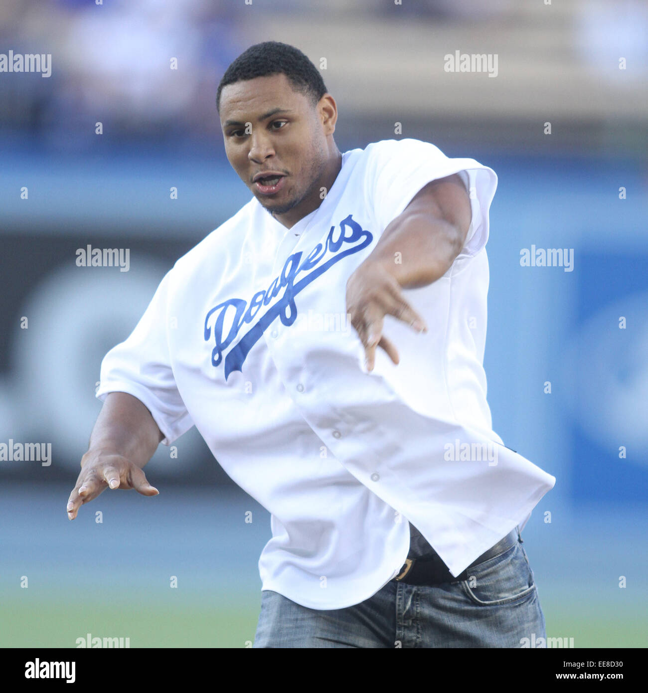 Celebrities attend a Los Angeles Dodgers v San Diego Padres game at Dodger Stadium in Los Angeles. The Padres defeated the Dodgers 6-3.  Featuring: Malcolm Smith Where: Los Angeles, California, United States When: 12 Jul 2014 Stock Photo