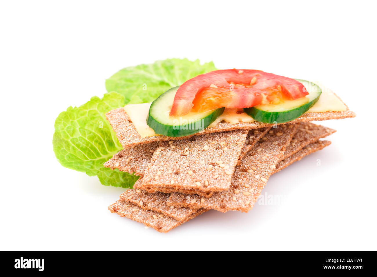Crackers with fresh vegetables and cheese isolated on white background ...