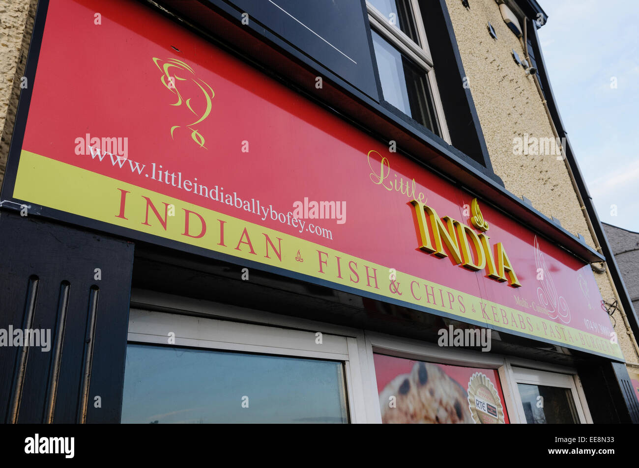 Indian take-away, also selling fish and chips, kebabs, pasta and burgers Stock Photo