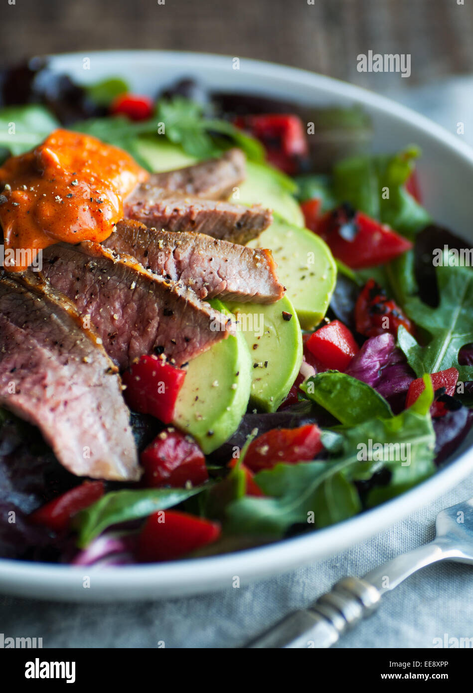 Mixed green salad with roast beef and smoked paprika aioli Stock Photo Alamy