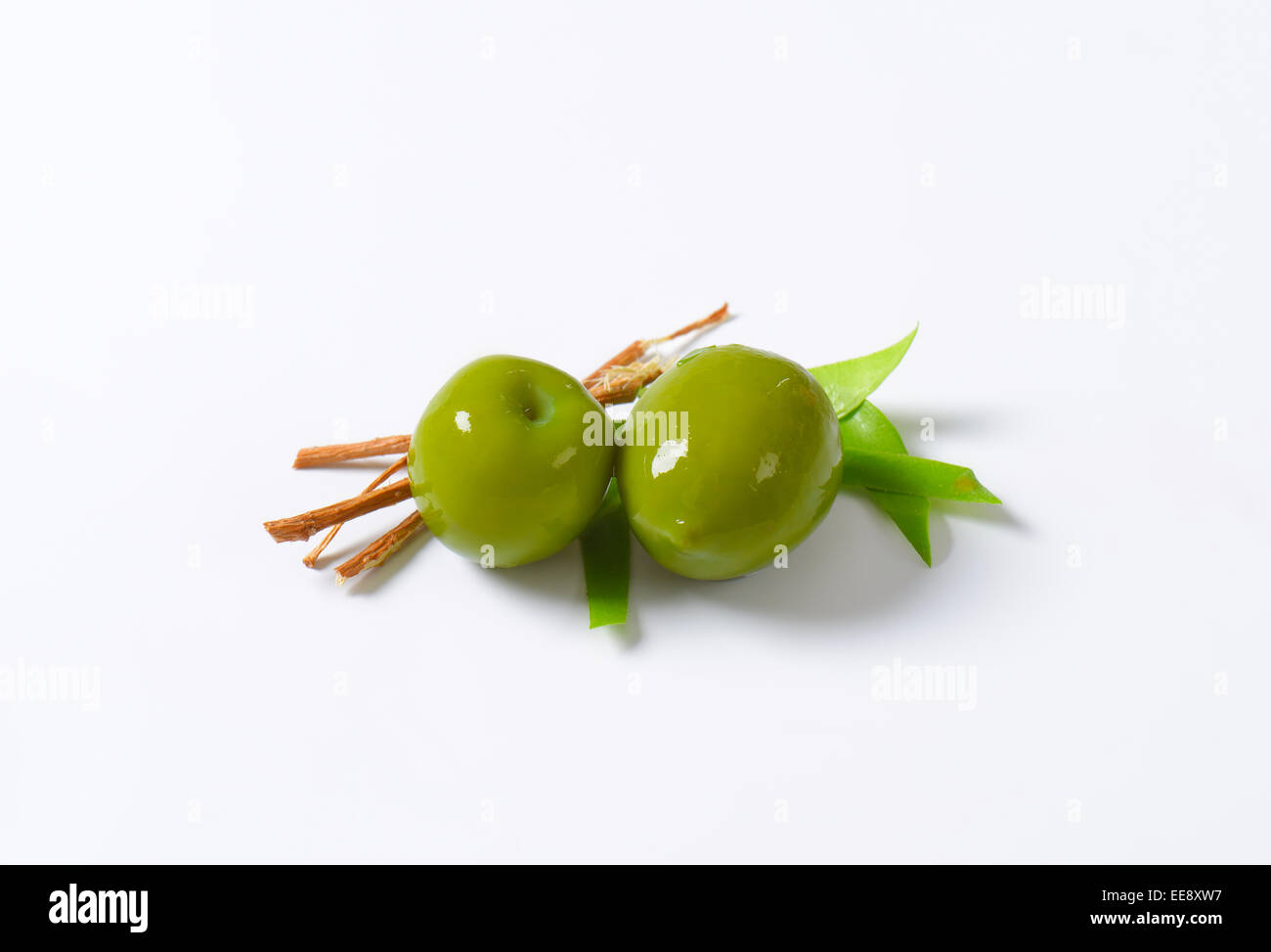 Fresh green olives on white background Stock Photo - Alamy