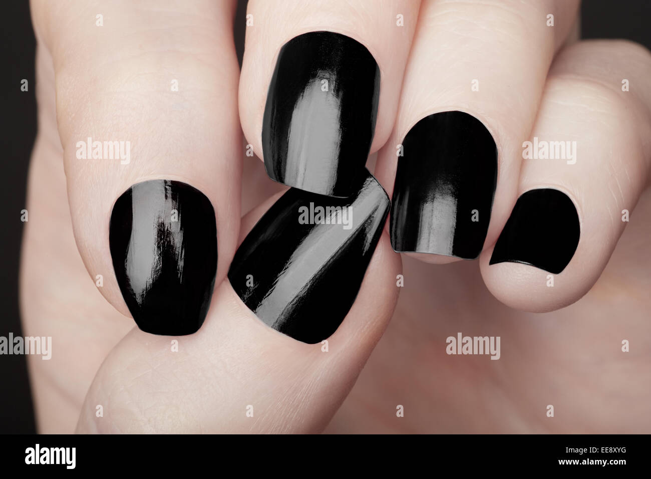 manicure on female hands with black nail polish EE8XYG