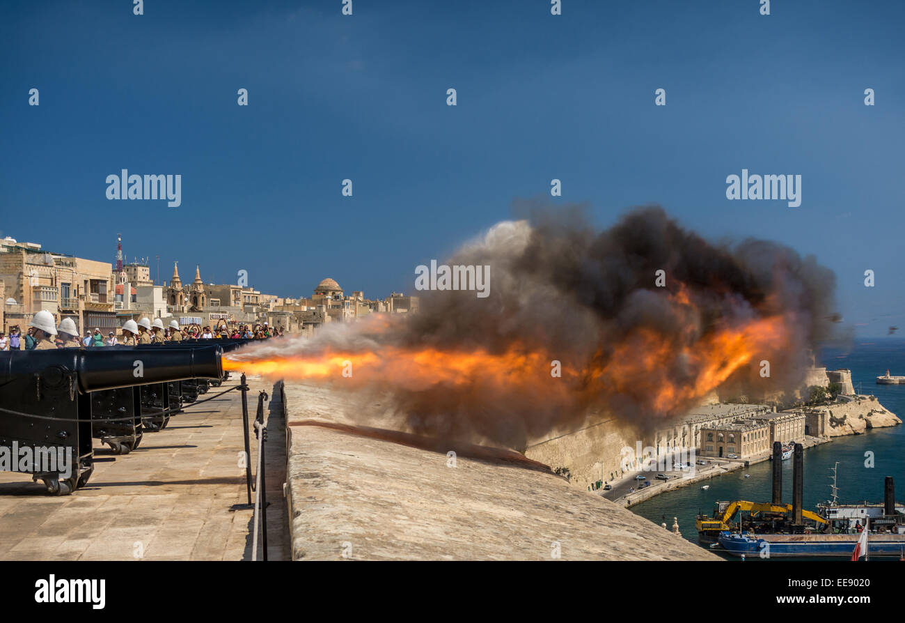 Canon, firing a salute from the signal battery in Valletta Stock Photo