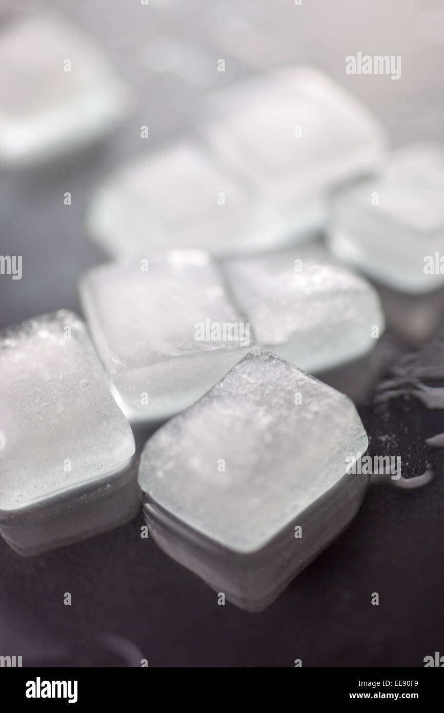 Ice cubes on a glass surface. Stock Photo
