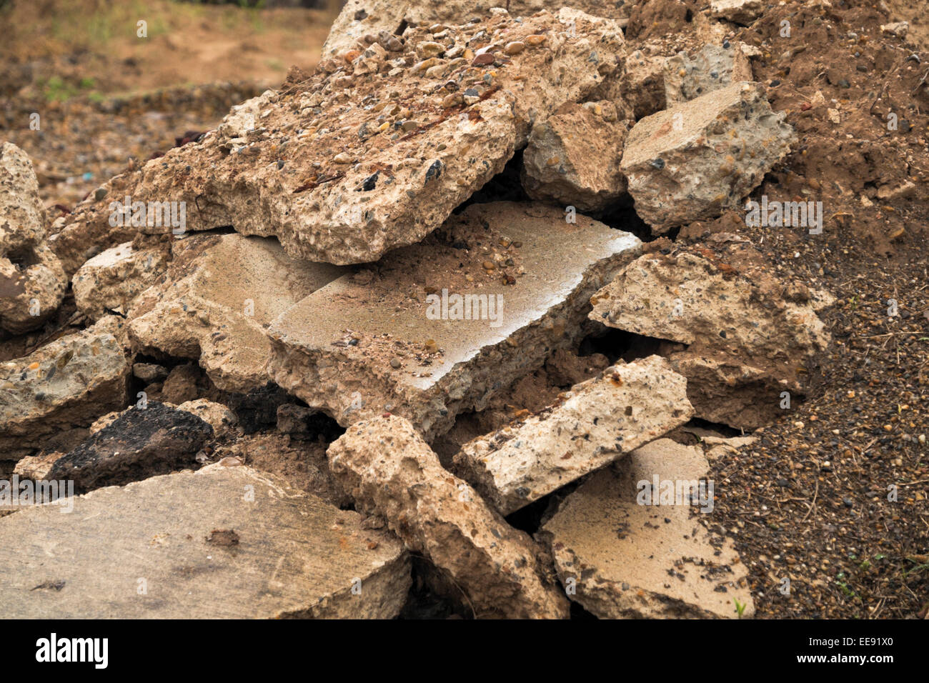 Rubble pile consisting of chunks of concrete, gravel and asphalt. Stock Photo