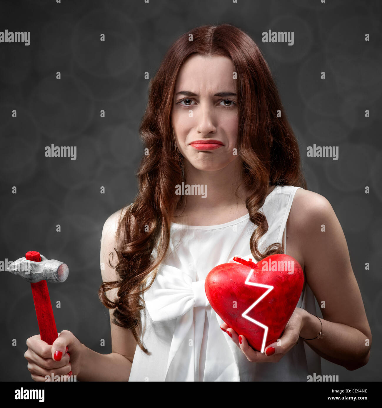 Woman with broken heart Stock Photo