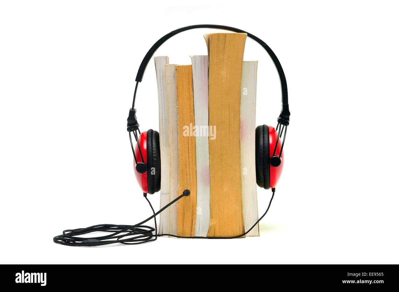 Headphones on books isolated on white representing audiobook concept Stock Photo