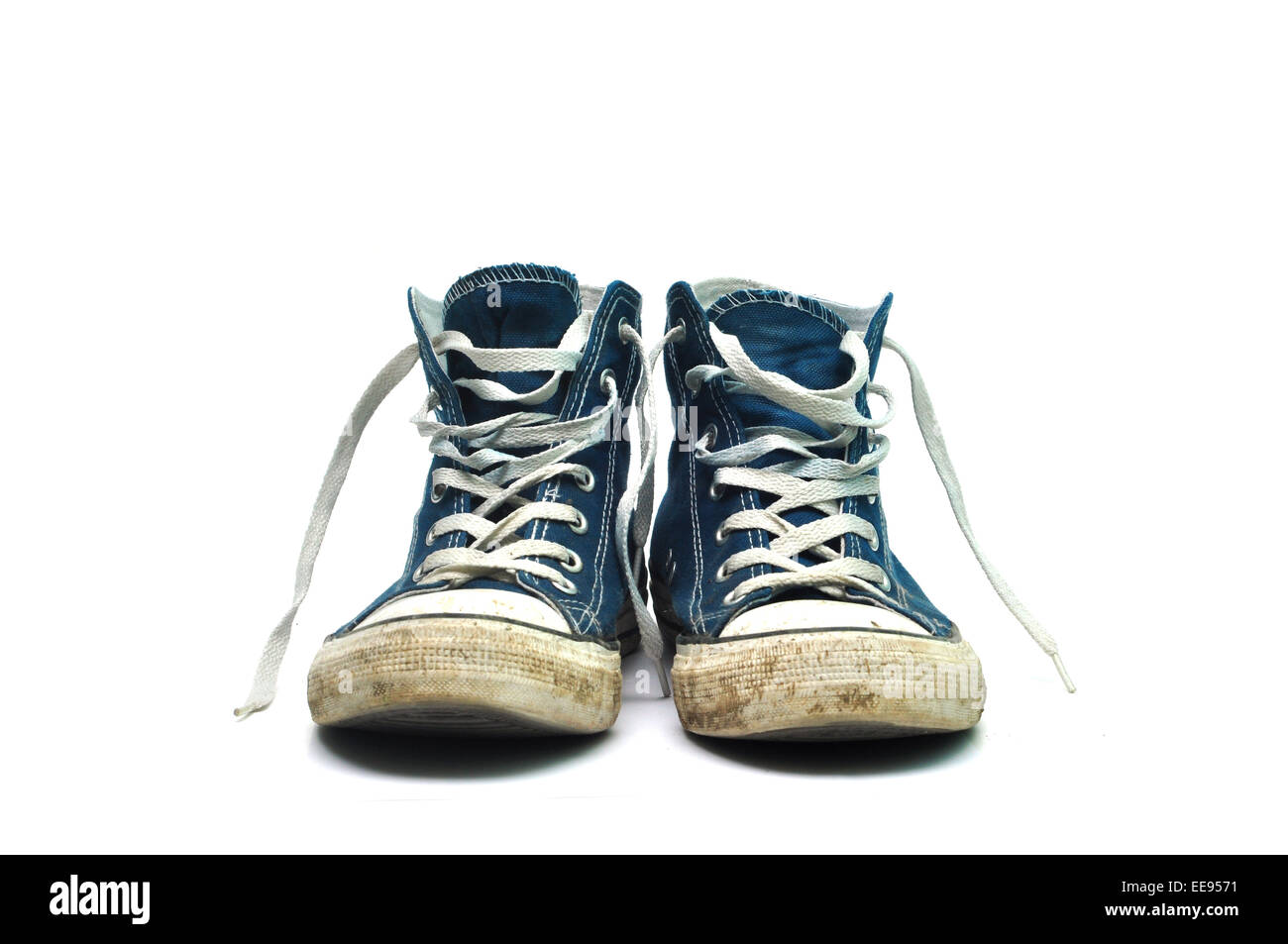 old sneakers dirty sport shoes over white background Stock Photo