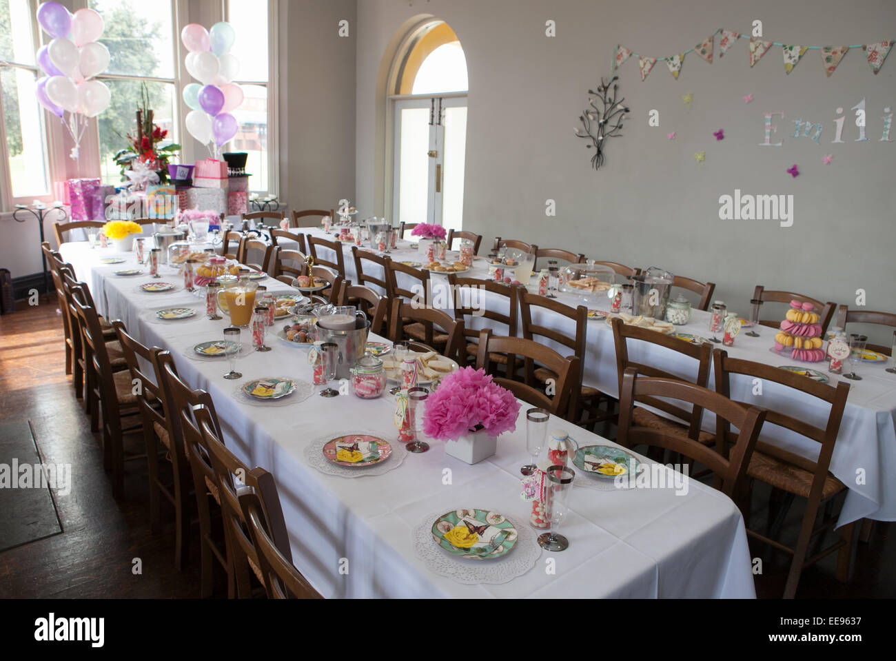 Tables and food at a young childs birthday party Stock Photo
