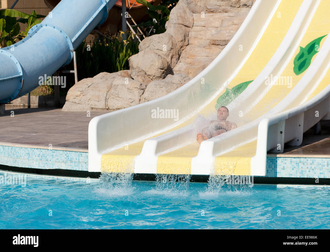 Man riding a water slide Stock Photo Alamy