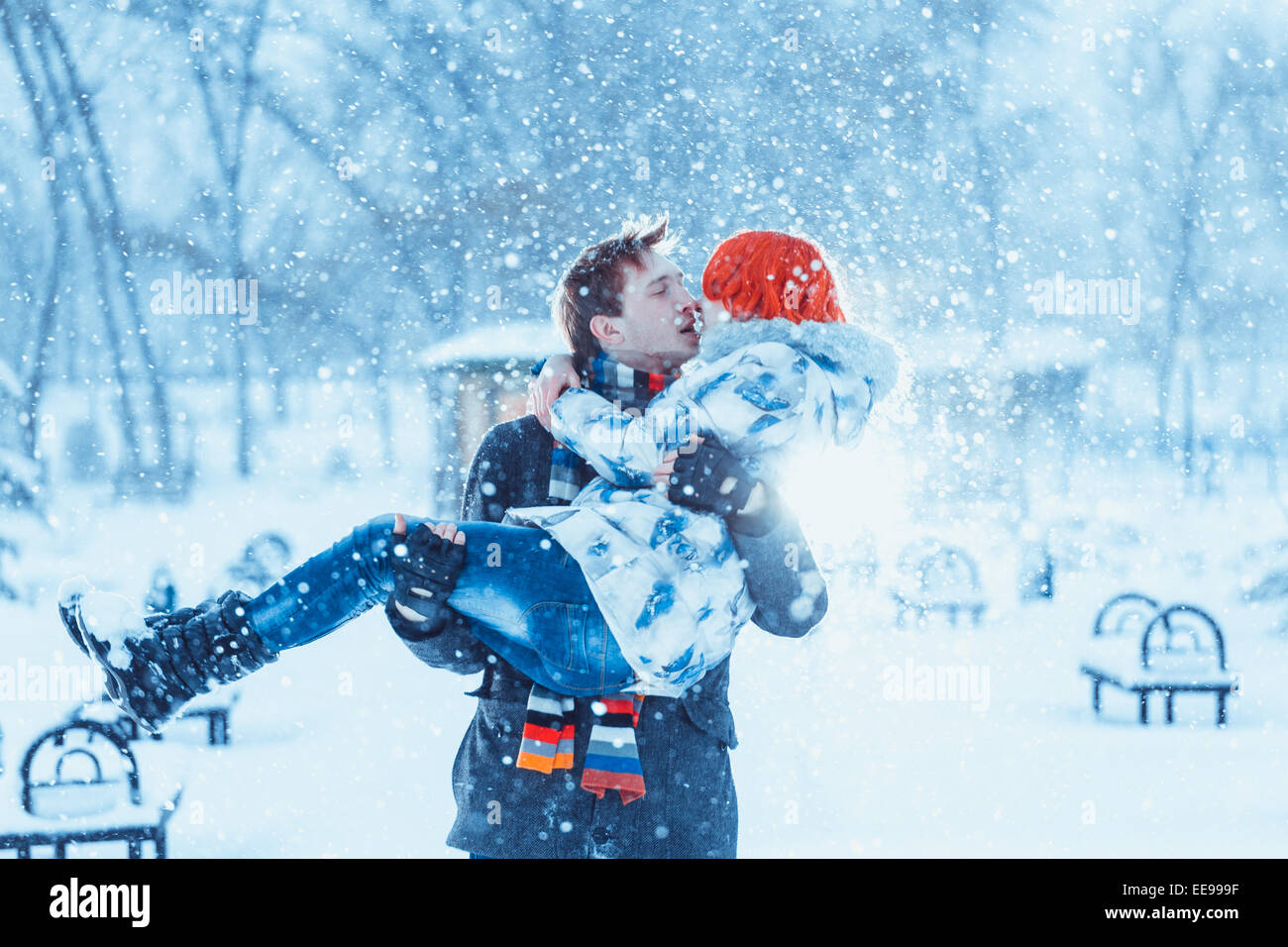 Happy Young Couple in Winter Park Stock Photo - Alamy