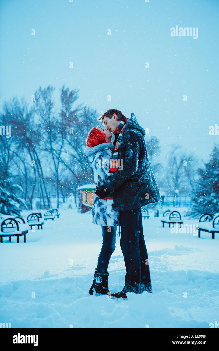 Happy Young Couple in Winter Park Stock Photo - Alamy