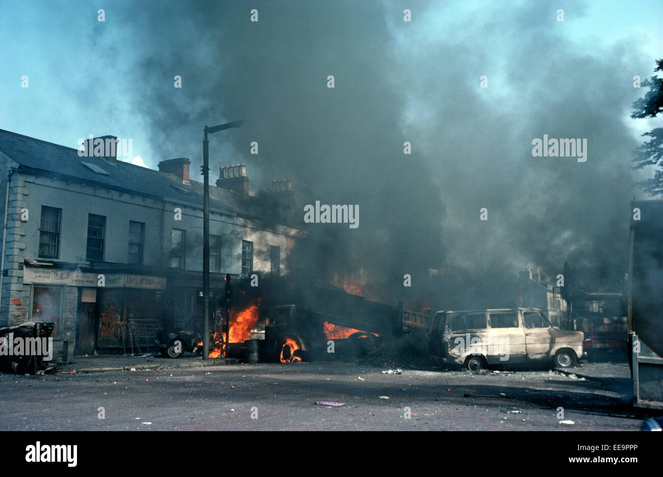 BELFAST, UNITED KINGDOM - August 1976, Burning Barricades during Troubles Riots in the Falls Road, West Belfast, 1976, Northern Ireland. Stock Photo