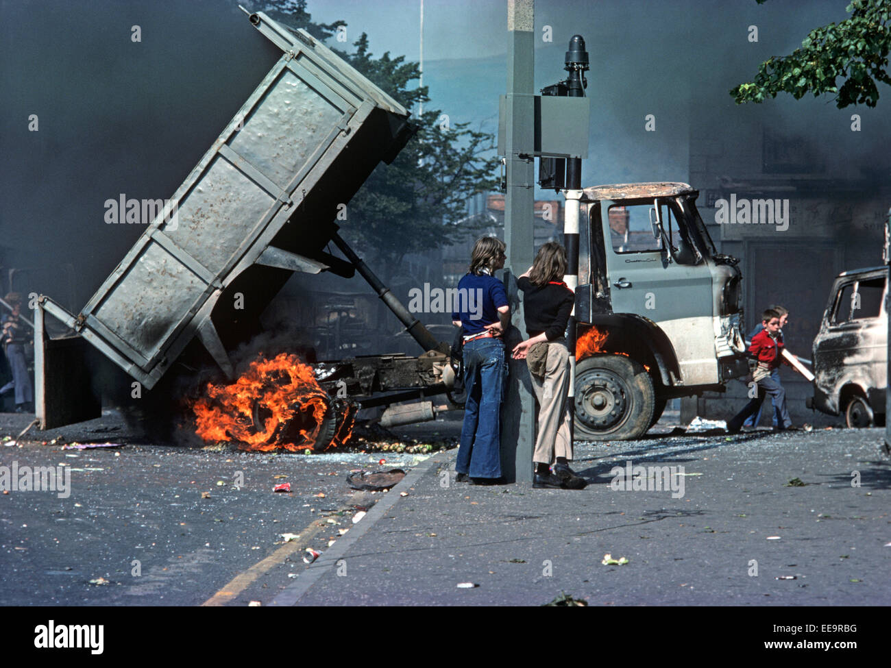 BELFAST, UNITED KINGDOM - August 1976, Young Nationalists during Riots in the Falls Road, West Belfast during the Troubles in 1976, Northern Ireland, Stock Photo