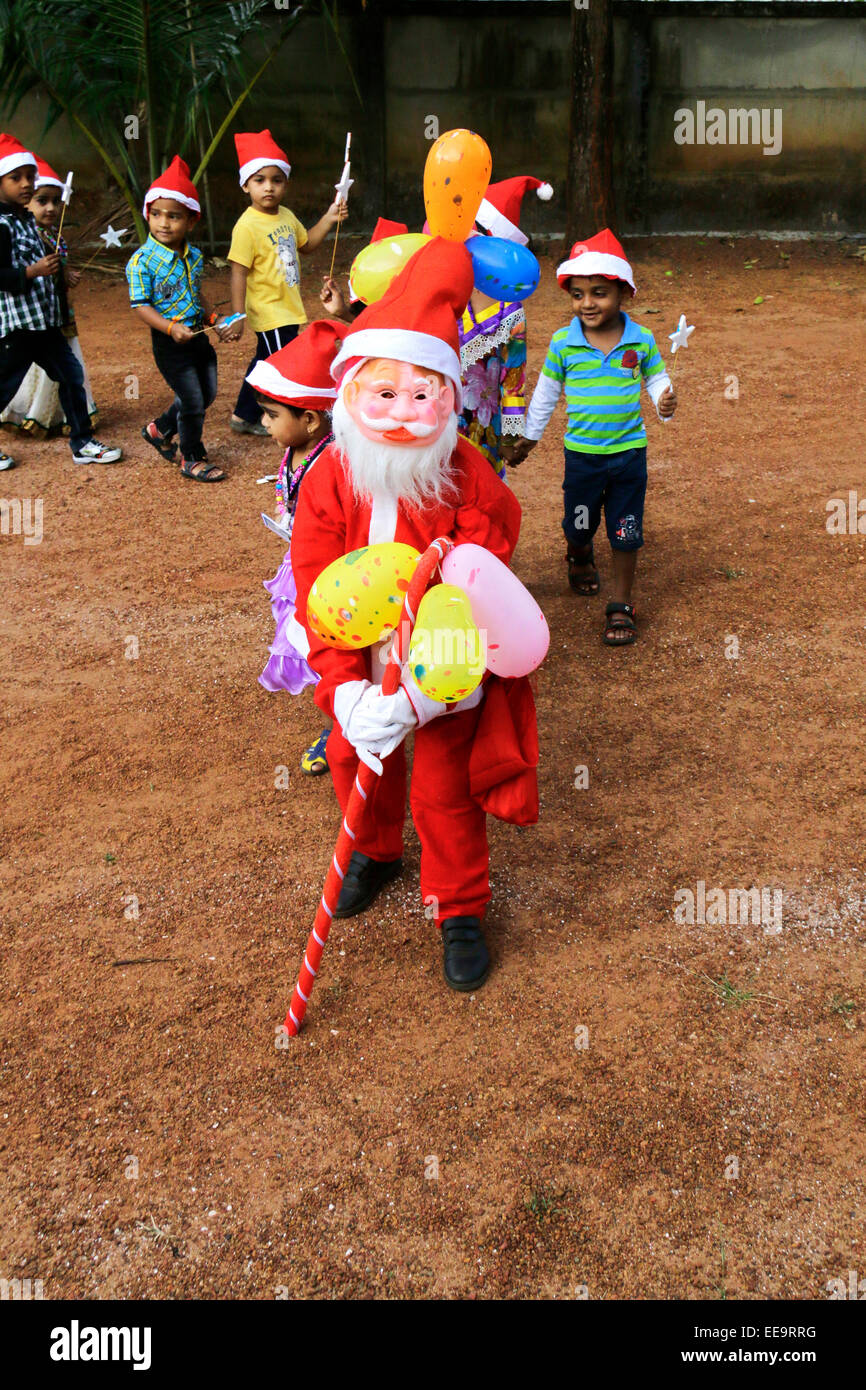 school kids celebrating christmas in kerala,india wearing santa clause