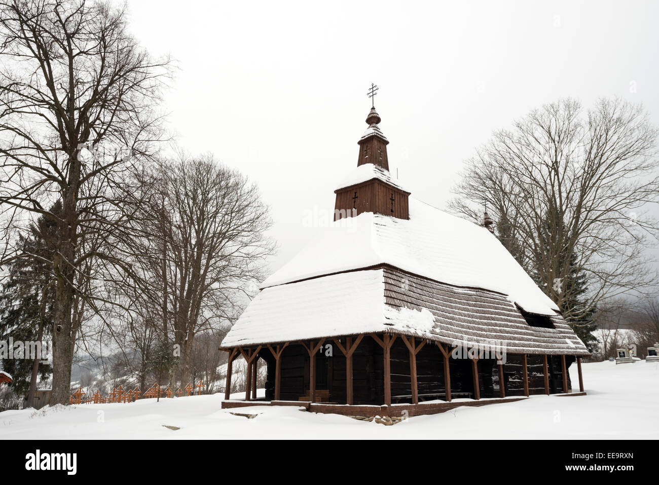 The Greek Catholic wooden church of St Michael the Archangel in Topola, Slovakia covered by snow Stock Photo