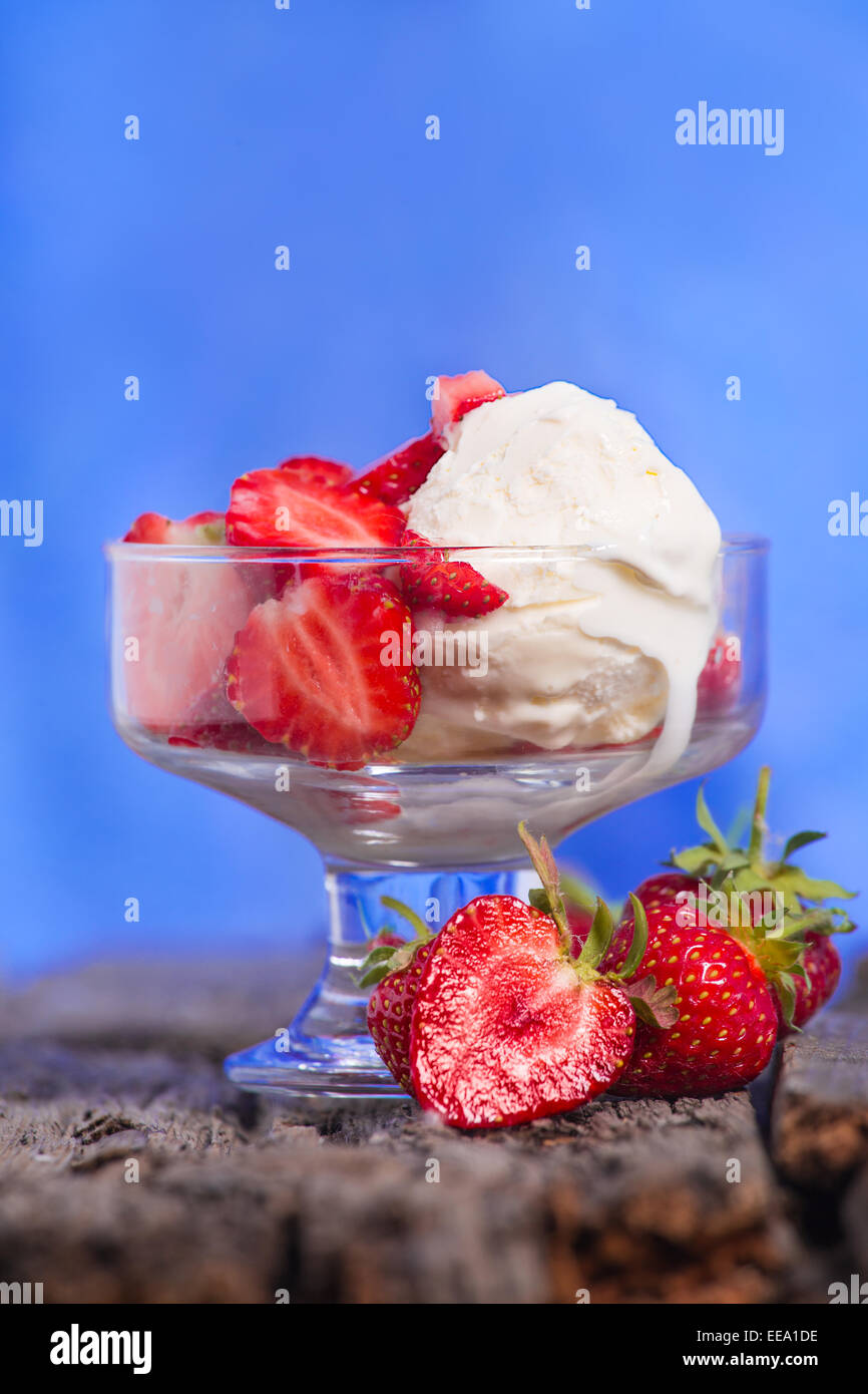 Ice cream with strawberries and whipped cream Stock Photo