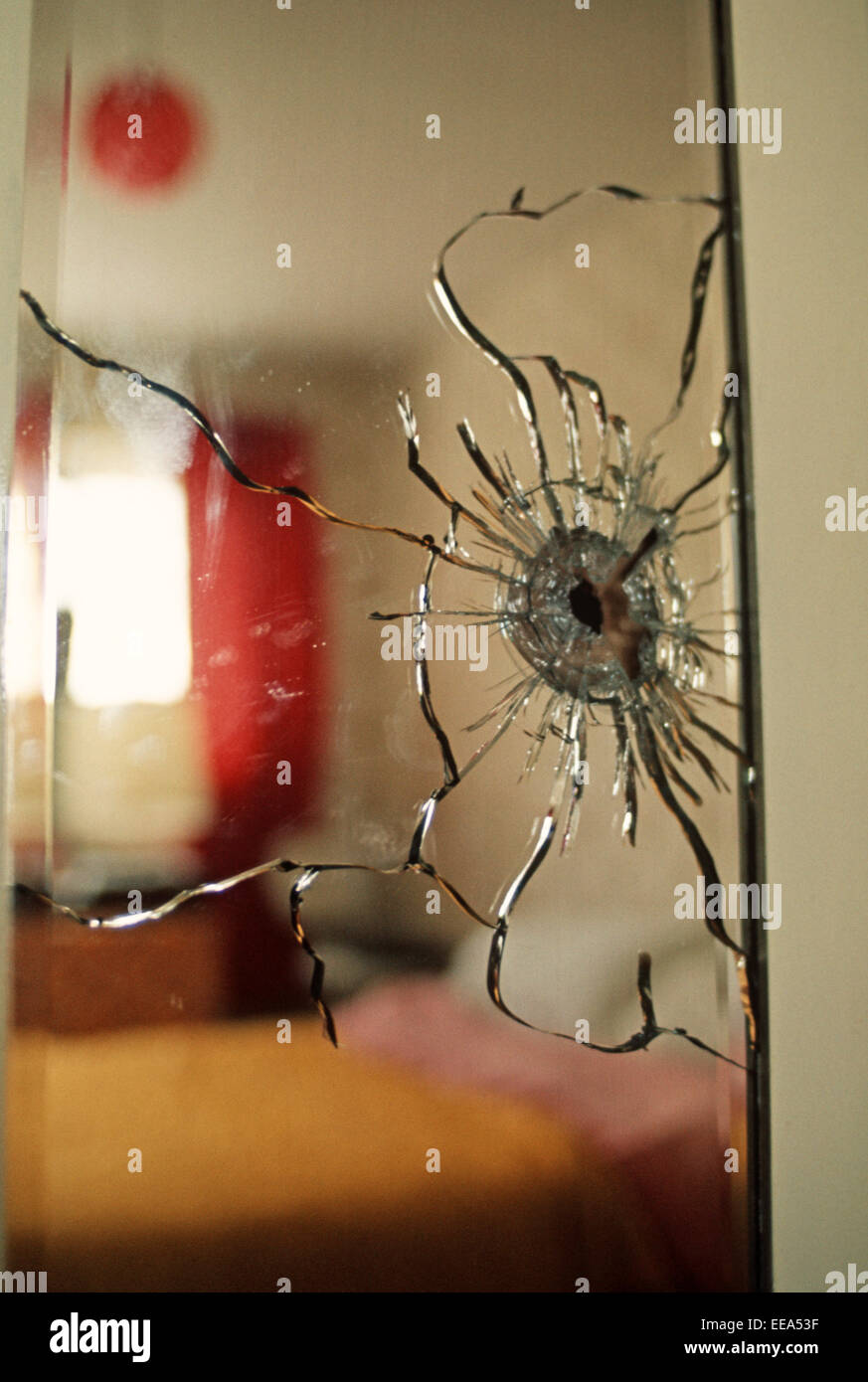 BELFAST, NORTHERN IRELAND MAY 1972. Bedroom wardrobe cracked mirror