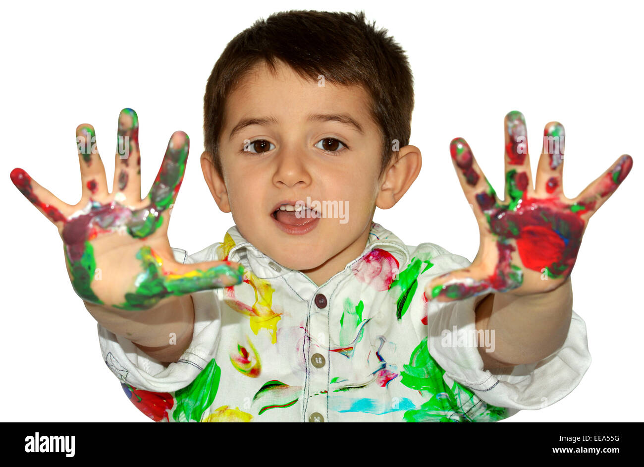 Little boy painting with hands with different color paint on his palms Stock Photo