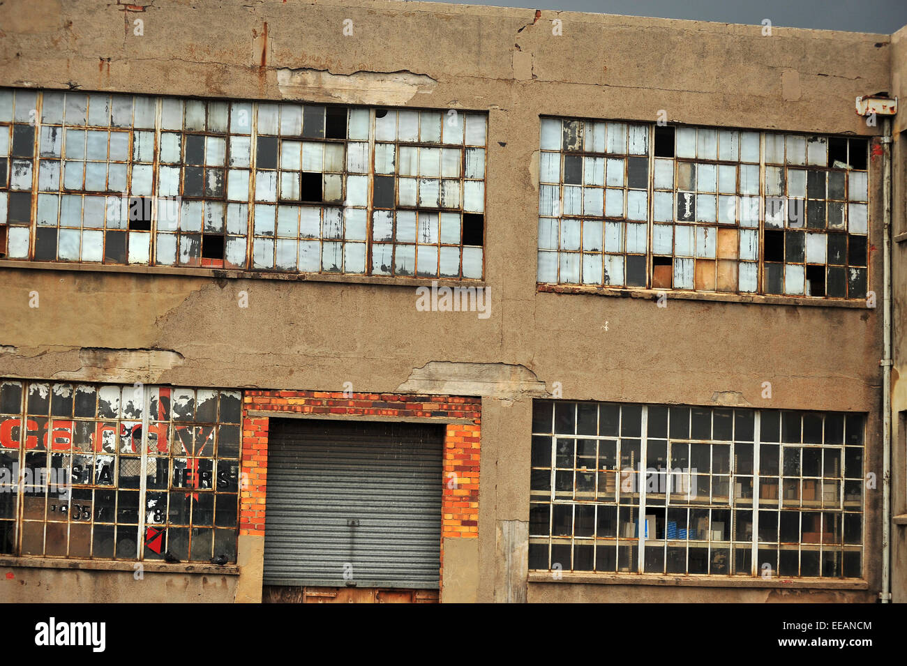 Smashed windows on a derelict warehouse in the centre of Johannesburg