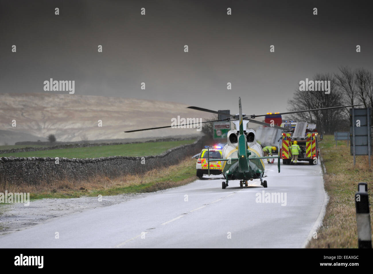 Air Ambulance attending a road traffic accidentin icy weather, Kirkby Stephen, Cumbria, UK Stock Photo