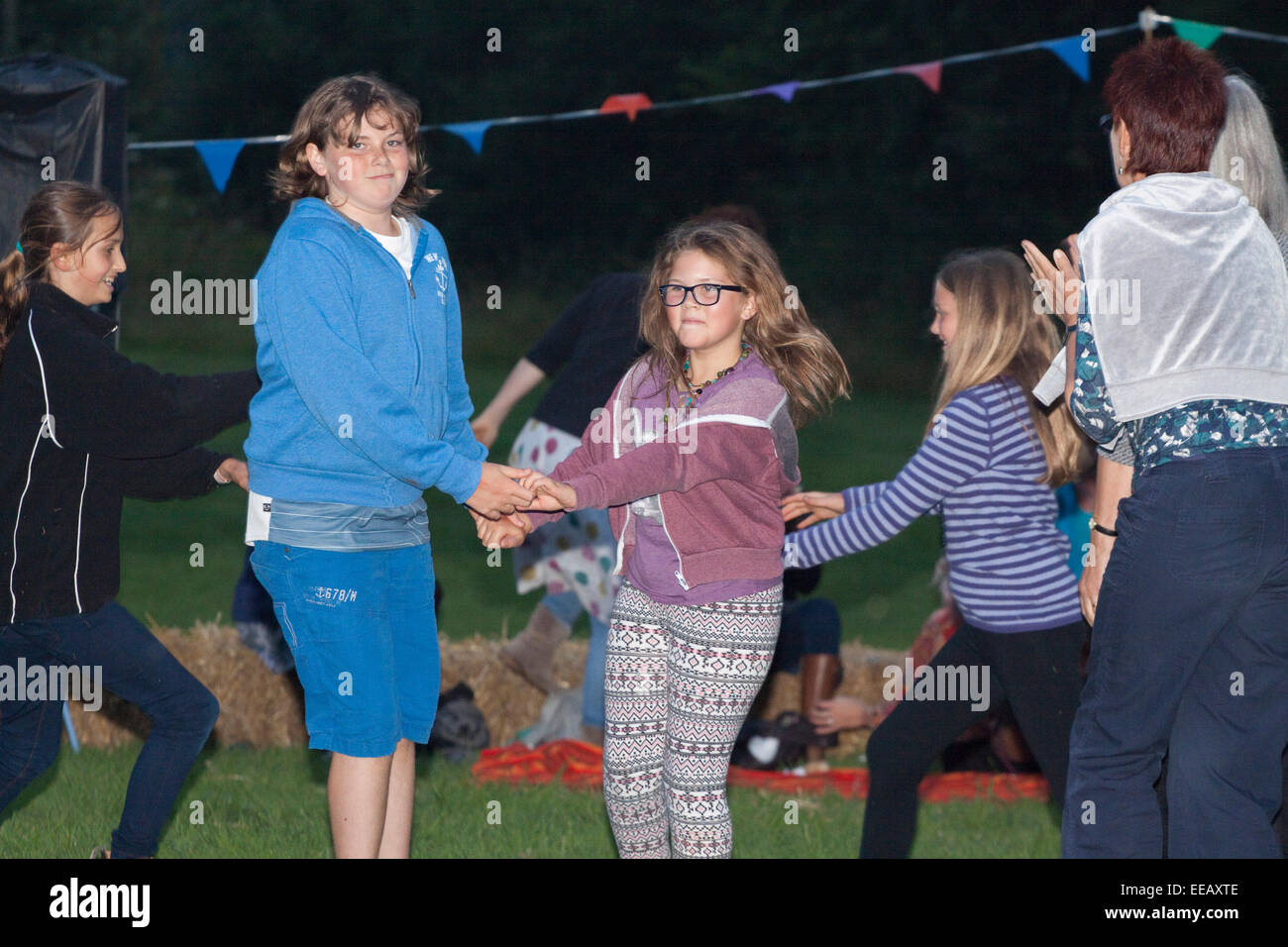 embarassed girls Two teenage girls look slightly embarrassed to be photographed country  dancing Stock Photo - Alamy