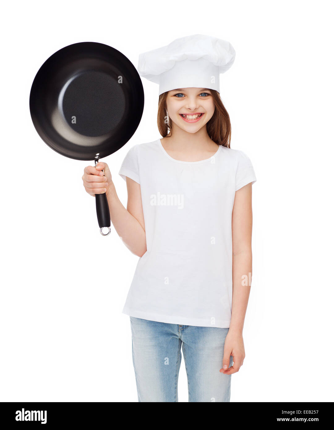 smiling girl in cook hat with frying pan Stock Photo