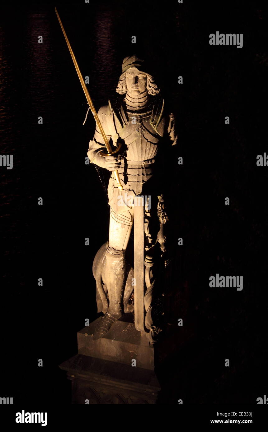 Statue of the knight Bruncvik by night along the Charles bridge in