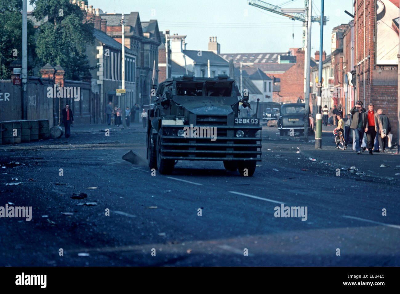 BELFAST, NORTHERN IRELAND - AUGUST 1976. British Army Saracen Personnel Carrier on the Falls Road, West Belfast after a night of Rioting during The Troubles, Northern Ireland. Stock Photo