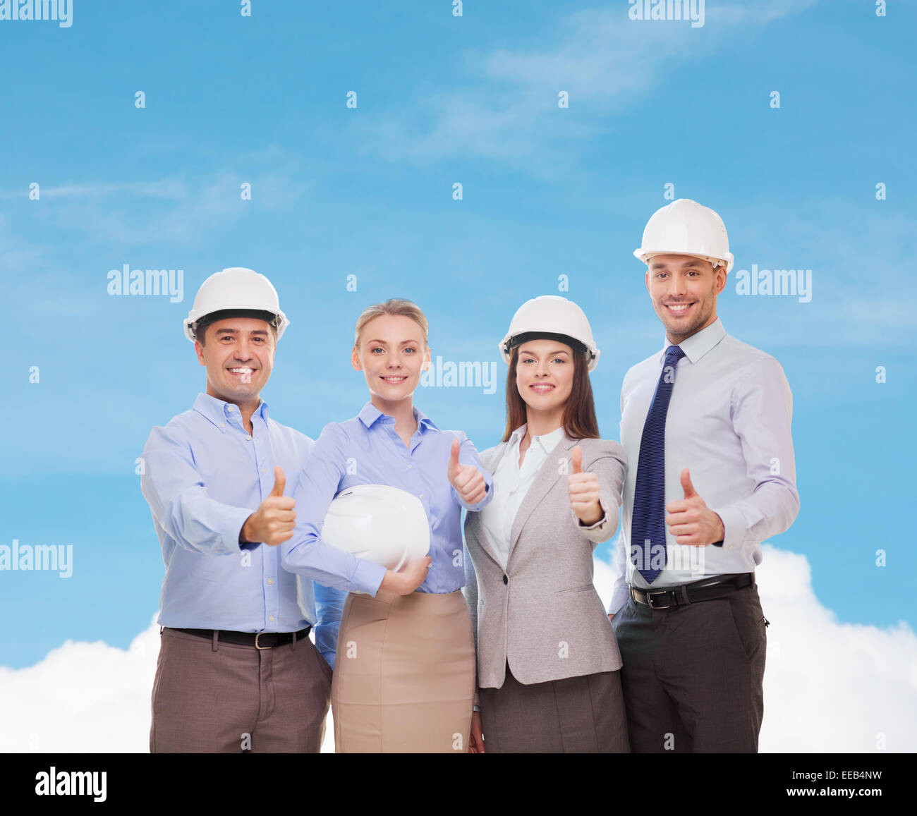 happy business team in office showing thumbs up Stock Photo - Alamy