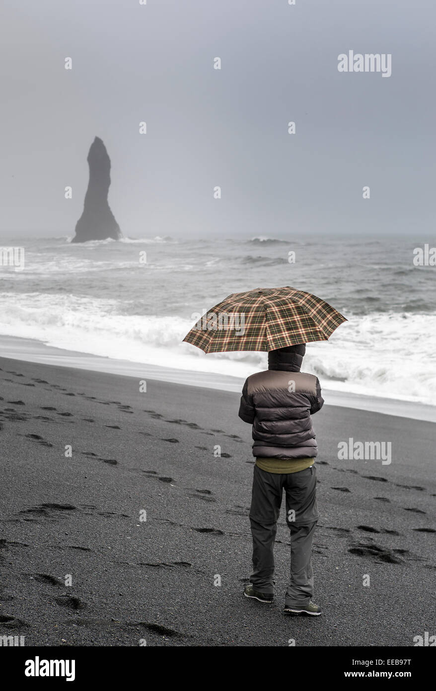 Basalt Sea Stacks and waves at Reynisfjara Beach, South Coast of Iceland. Stock Photo