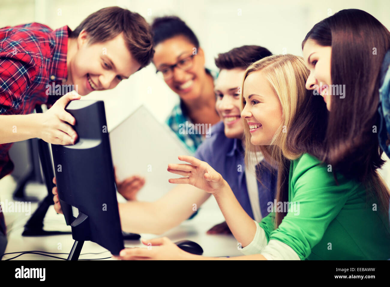 students looking at computer monitor at school Stock Photo - Alamy