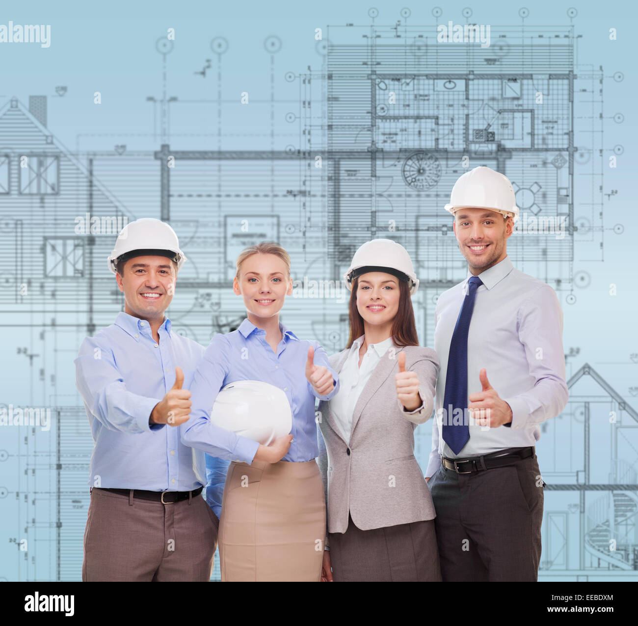happy business team in office showing thumbs up Stock Photo - Alamy