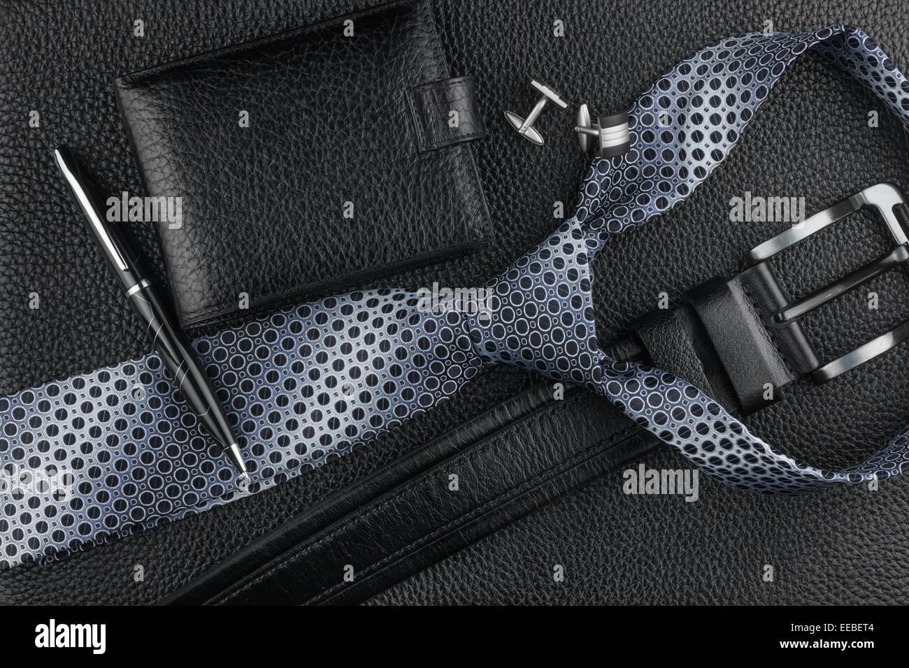 Tie, belt, wallet, cufflinks, pen lying on the skin, can be used as